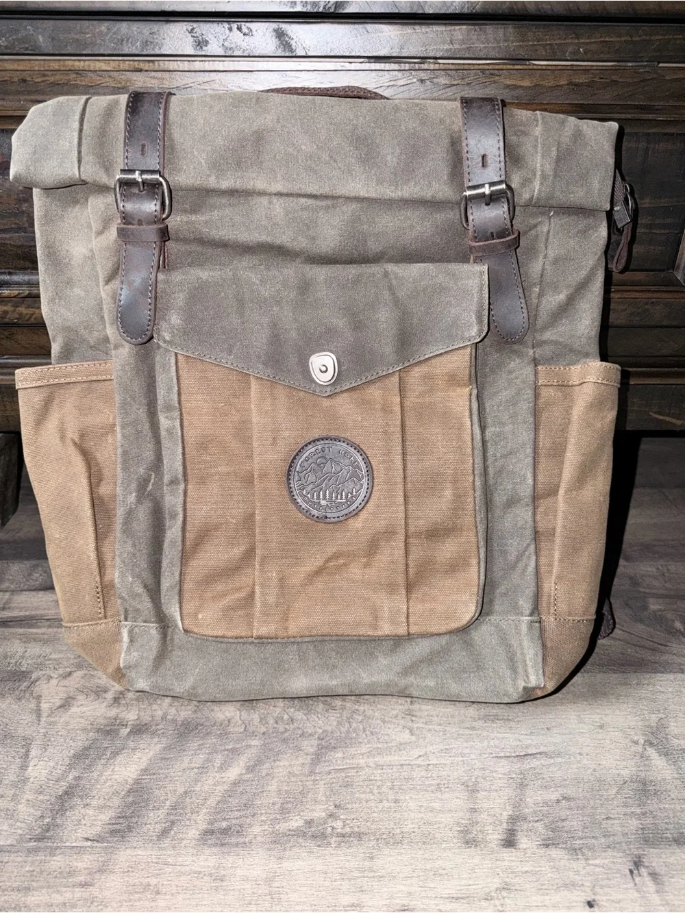 Waxed Canvas Roll-Top Backpack in army green and Brown